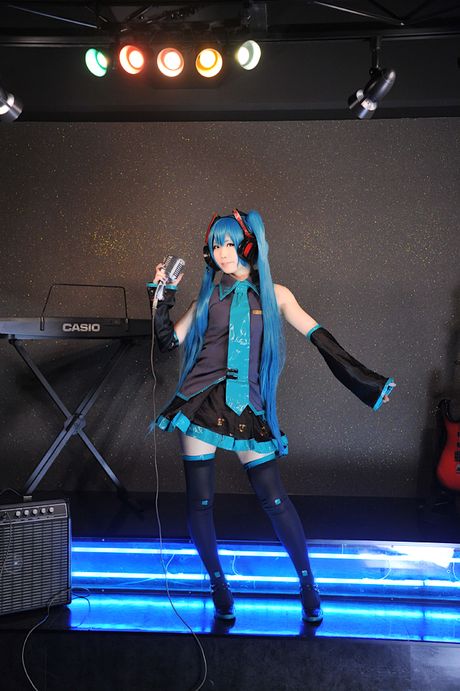 Asian teen Haruka demonstrates her petite small tits and poses in black stockings