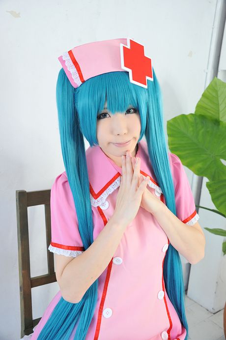 Fantastic Asian nurse Haruka strips her uniform and poses in pink stockings