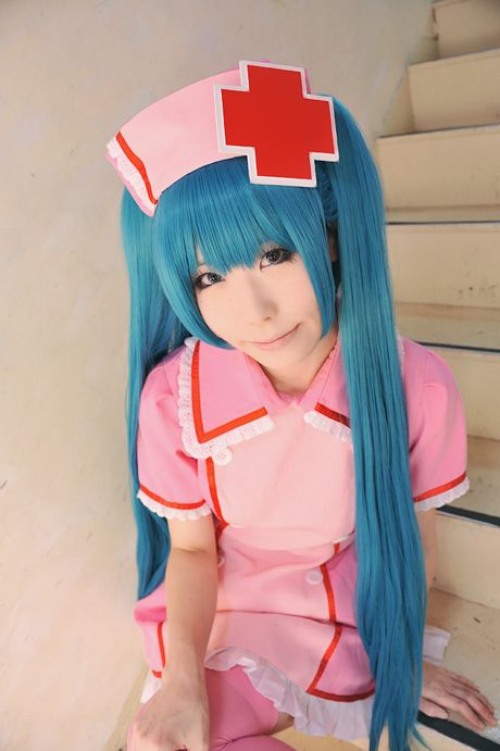 Fantastic Asian nurse Haruka strips her uniform and poses in pink stockings