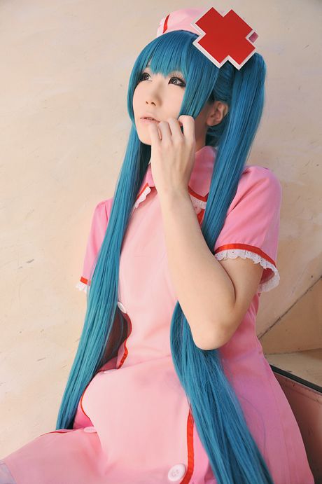 Fantastic Asian nurse Haruka strips her uniform and poses in pink stockings