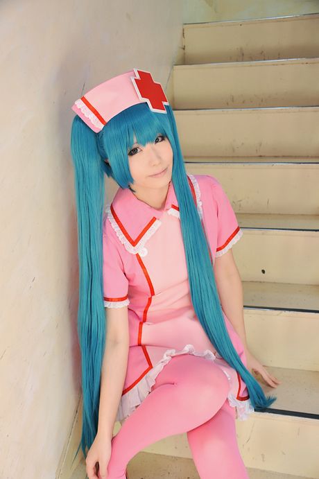 Fantastic Asian nurse Haruka strips her uniform and poses in pink stockings