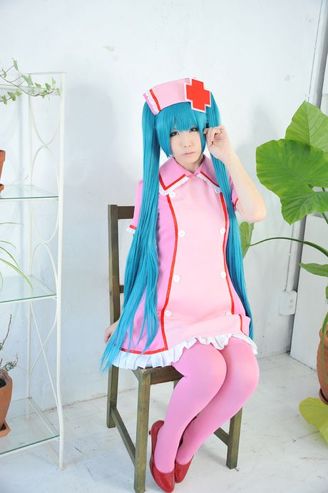 Fantastic Asian nurse Haruka strips her uniform and poses in pink stockings