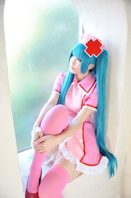 Fantastic Asian nurse Haruka strips her uniform and poses in pink stockings