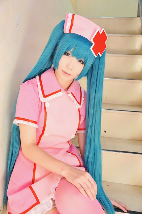 Fantastic Asian nurse Haruka strips her uniform and poses in pink stockings