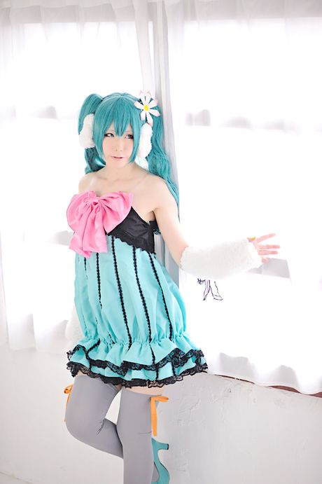 Striking japanese beauty Haruka presents her tiny tits and poses in white stockings