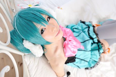 Striking japanese beauty Haruka presents her tiny tits and poses in white stockings