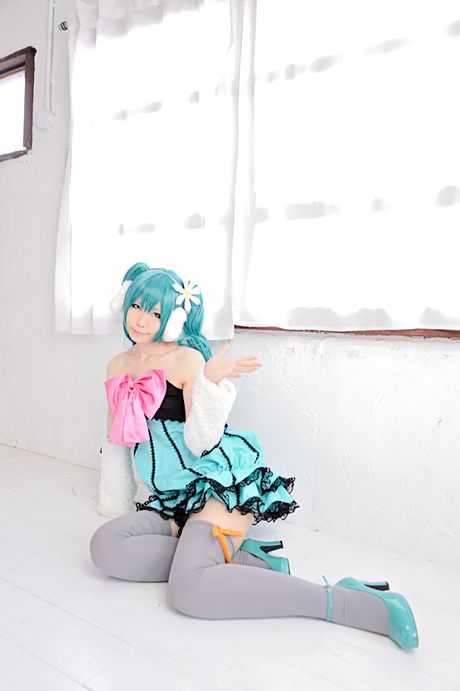 Striking japanese beauty Haruka presents her tiny tits and poses in white stockings