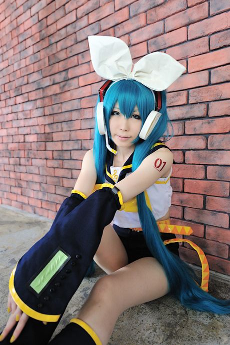 Cute cosplay girl Haruka demonstrates her small boobs and her bald pussy