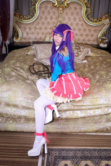 Purple hair model Kana Yume demonstrates her small tits and pussy in stockings