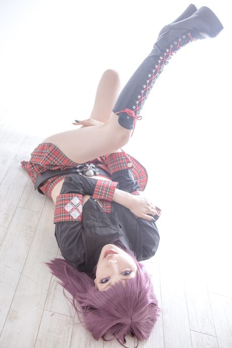 Asian covergirl Nonsummerjack sports a horned headpiece while posing in a corset