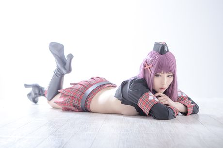 Asian covergirl Nonsummerjack sports a horned headpiece while posing in a corset