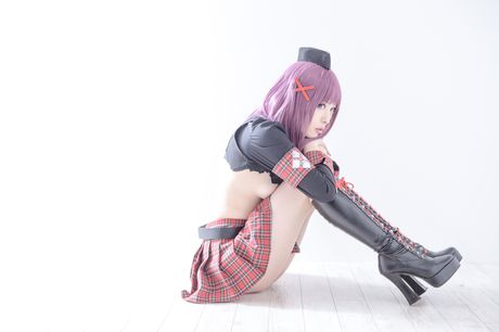 Asian covergirl Nonsummerjack sports a horned headpiece while posing in a corset