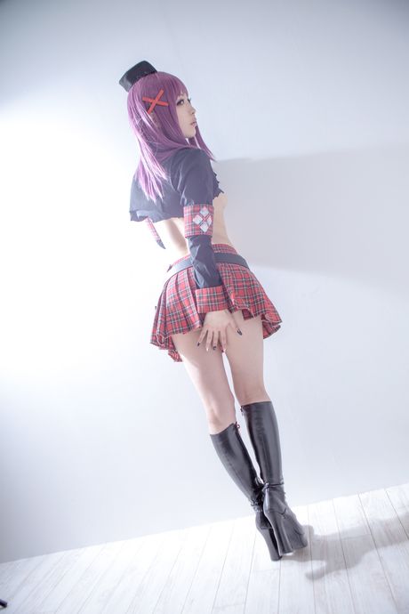 Asian covergirl Nonsummerjack sports a horned headpiece while posing in a corset