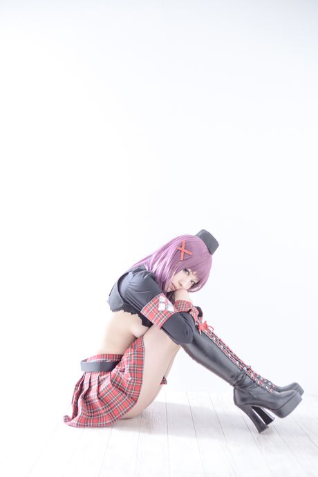 Asian covergirl Nonsummerjack sports a horned headpiece while posing in a corset