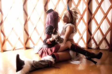 Asian covergirl Nonsummerjack sports a horned headpiece while posing in a corset