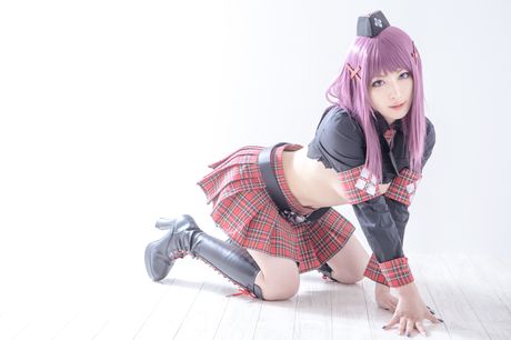 Asian covergirl Nonsummerjack sports a horned headpiece while posing in a corset