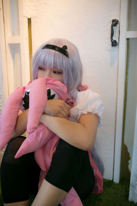 Asian teen Rat Sakura exhibits her petite tiny tits and poses in black stockings