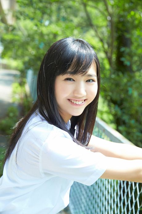 Asian doll Suenaga Mika models a bikini in the backyard with her friends