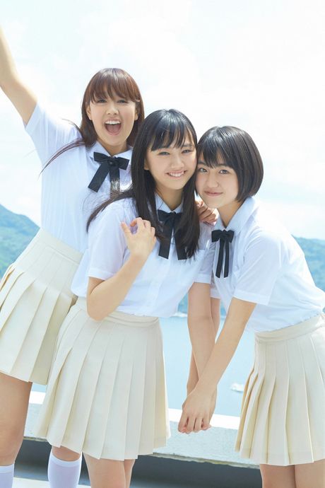 Asian doll Suenaga Mika models a bikini in the backyard with her friends