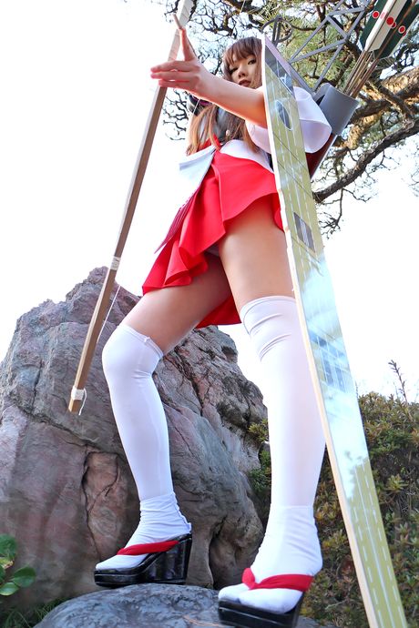 Asian girl Ran shows her small tits and poses in white stockings