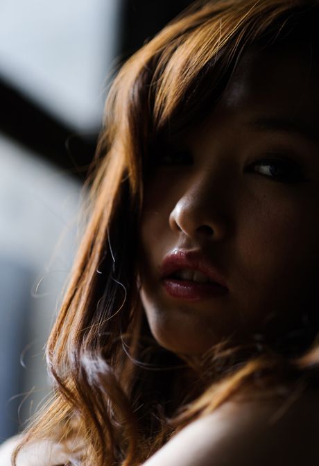 Asian Cougar Nono Mizusawa shows her amazing racks and poses in black stockings