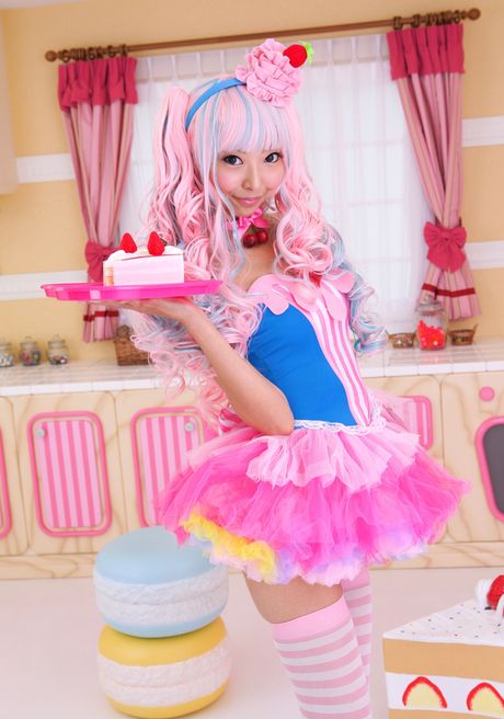 Asian covergirl Necoco demonstrates her petite small tits and poses in striped stockings