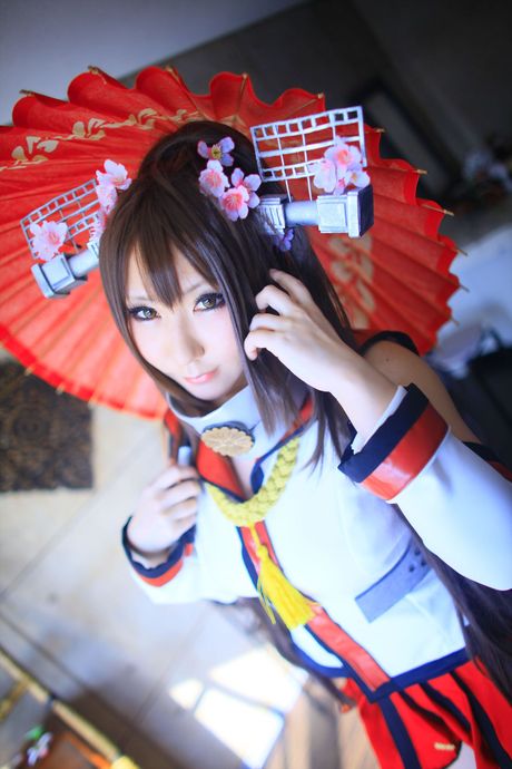 Asian teen Saku exposes her amazing juggs and poses in a hot red dress