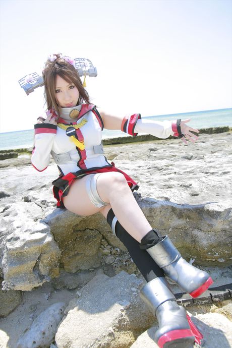 Asian teen Saku exposes her amazing juggs and poses in a hot red dress