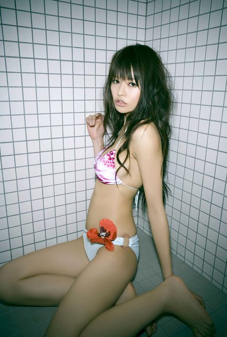 Asian covergirl Yuriko Shiratori exhibits her small boobs and poses in a bikini