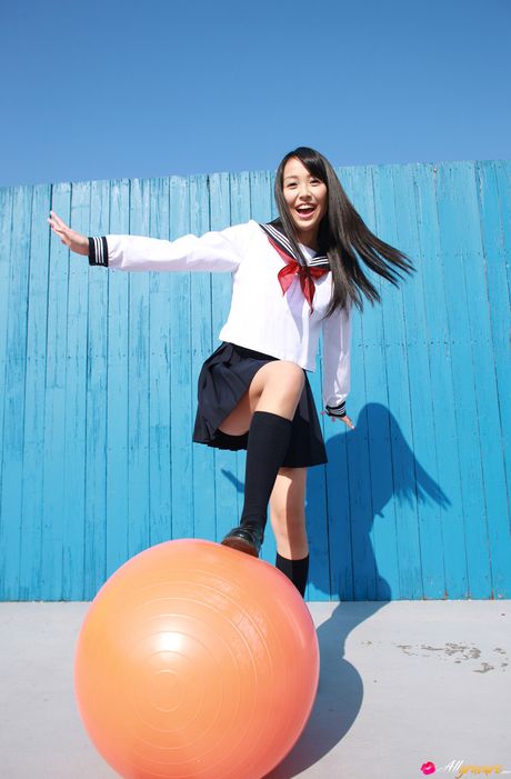 Asian schoolgirl Miyu Watanabe displays her small boobs and poses in stockings