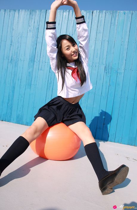 Asian schoolgirl Miyu Watanabe displays her small boobs and poses in stockings