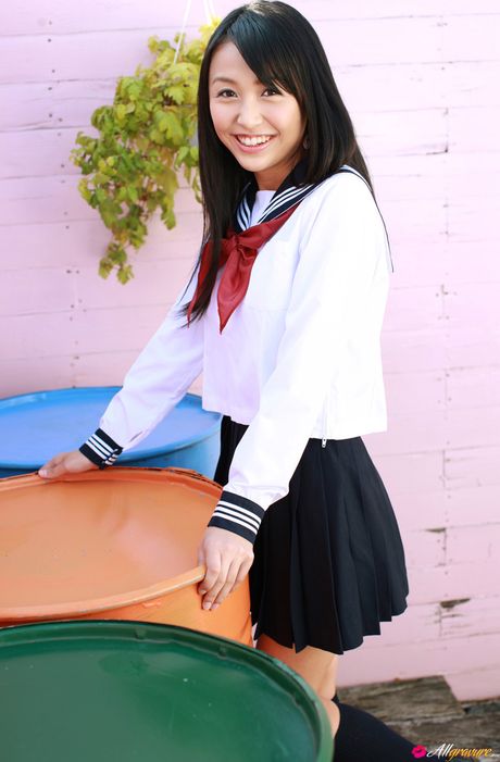 Asian schoolgirl Miyu Watanabe displays her small boobs and poses in stockings