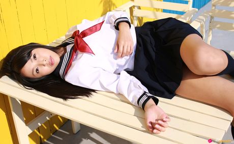 Asian schoolgirl Miyu Watanabe displays her small boobs and poses in stockings