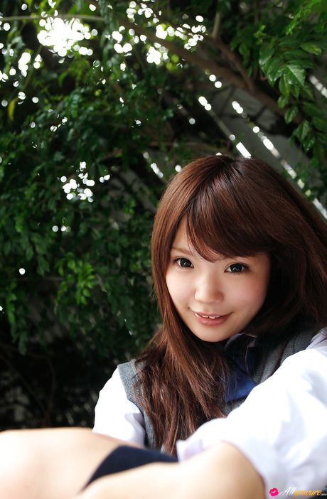 Asian cutie Manami Sato gets naked on a blanket in knee socks