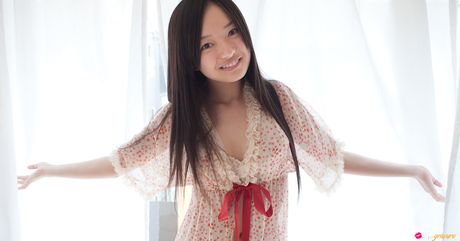 Asian teen Mayumi Yamanaka exposes her small tits and poses in a solo