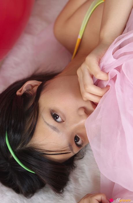 Asian babe Airi Sakuragi exhibits her huge tits and poses in a bikini