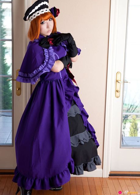 Red-haired Asian teen Saku presents her petite tits and poses in a solo