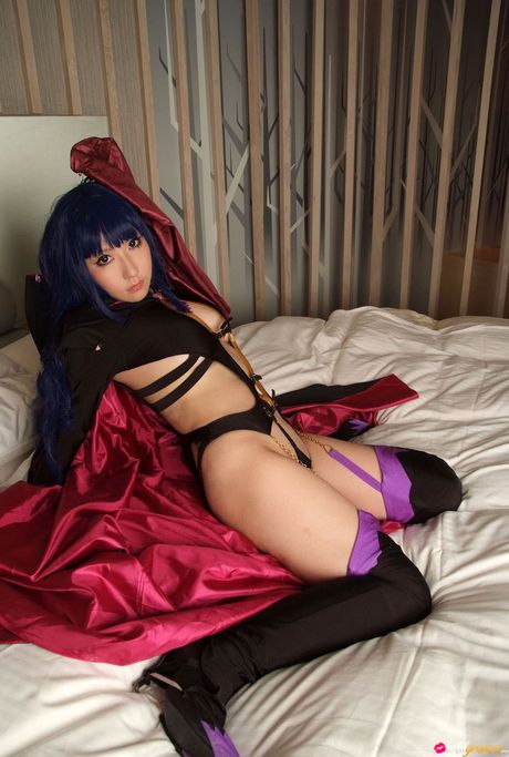 Asian teen Saku sports a shaved head while modelling in a black hoodie