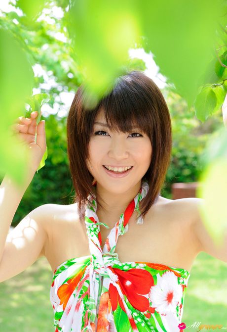 Asian babe Kyoka Mizusawa removes her dress and stands revealed in the nude in a solo