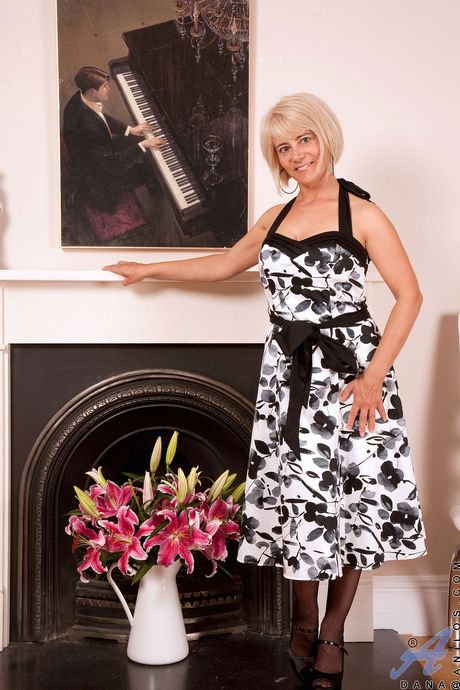 Superb aged Dana in fancy skirt exposing big boobies and playing with dildo 