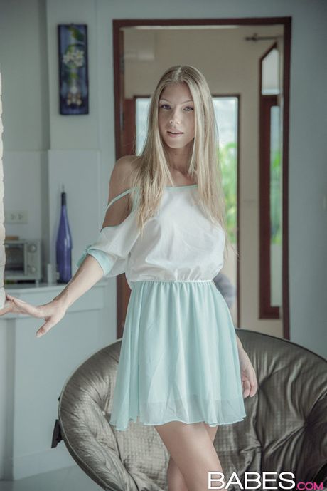 Blonde russian stunner Angelica slips off her panties before masturbating