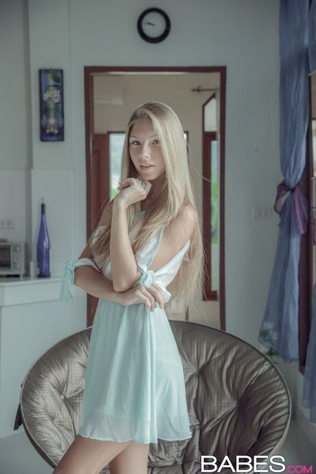 Blonde russian stunner Angelica slips off her panties before masturbating