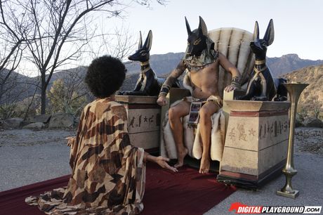 Ebony american covergirl Skin Diamond gets banged on a stone pedestal in the desert