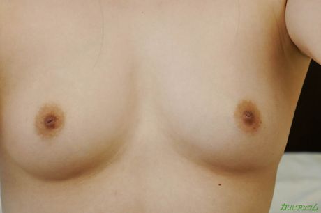 Asian chick Mai Shirakawa shows her big juggs and rubs her pussy