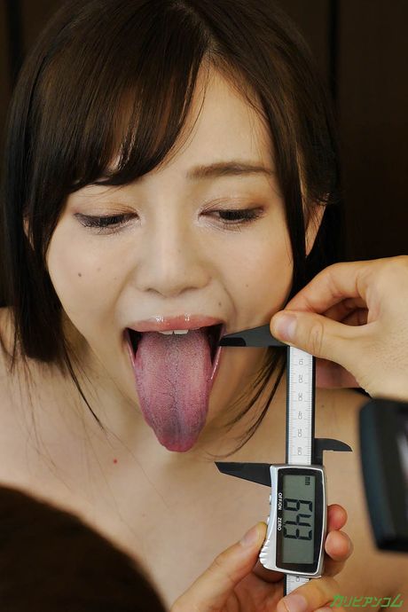 Asian chick Mai Shirakawa shows her big juggs and rubs her pussy