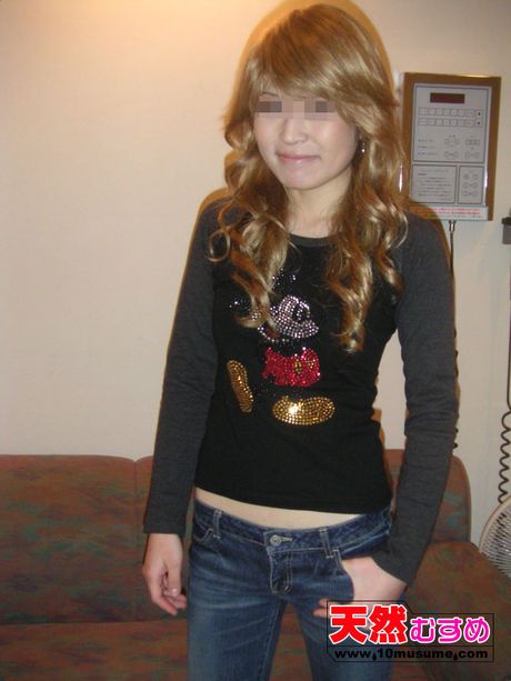 Skinny Asian teen Eri strips to her black panties and displays her bare flesh