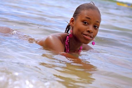 Beautiful teen Tierra shows off her naked body in a bathtub full of water