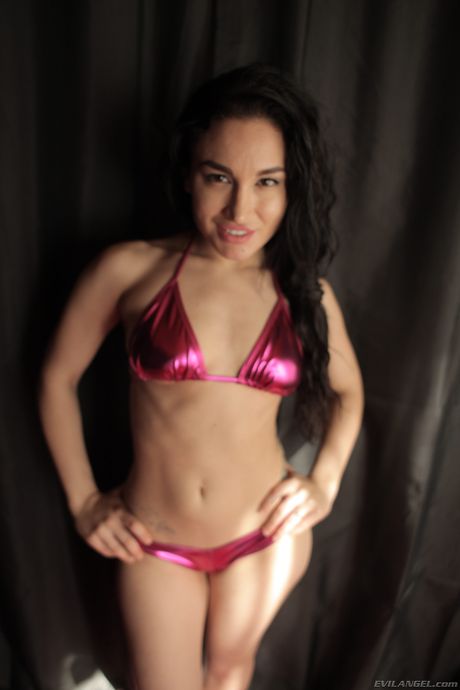 Four lesbian girls show off their asses in bikinis on a bed