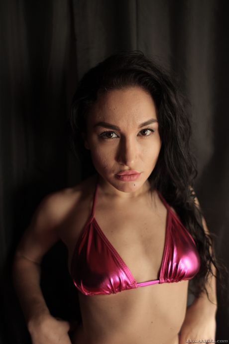 Four lesbian girls show off their asses in bikinis on a bed