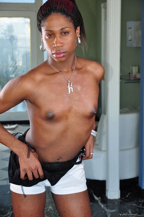 Brunette shemale Lovely B shows her perfect butt and masturbates with her dick